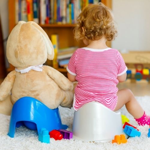 toddler and bear on potty