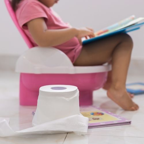 toddler reading on potty