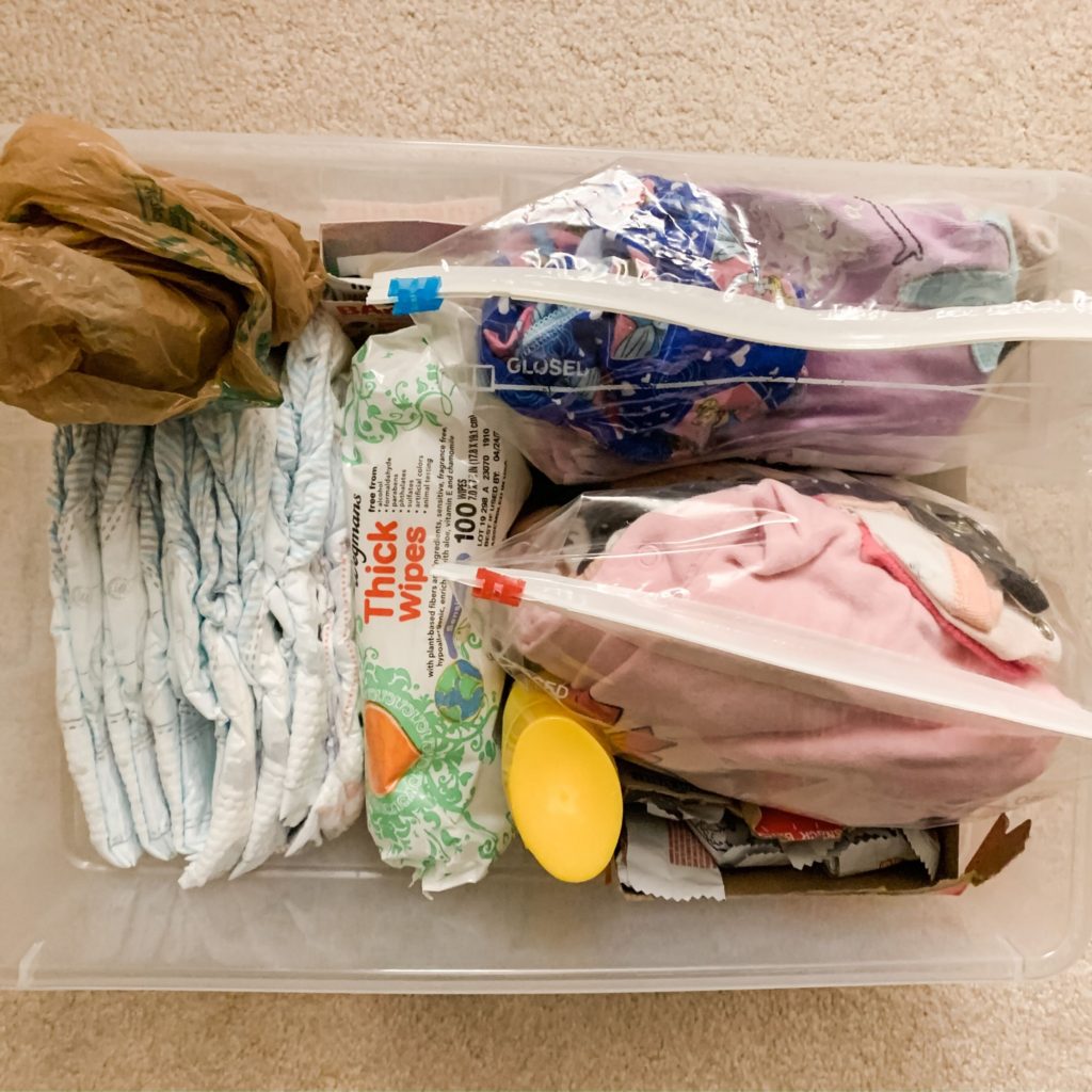 Keep a bin of essential items in your car to make mom life easier!