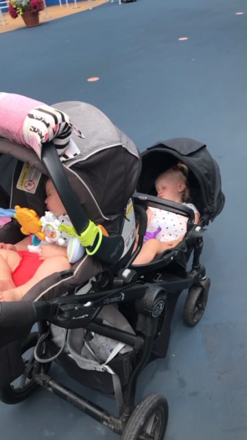 babies sleeping in double stroller