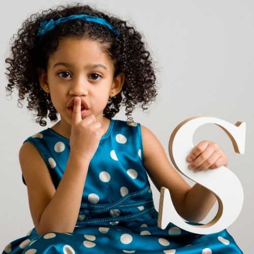 little girl with letter S