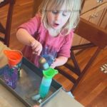 Indoor Toddler Water Activity: DIY Pouring Station - These Hungry Kids