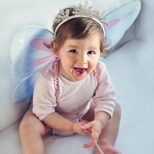 baby girl in a crown and fairy wings