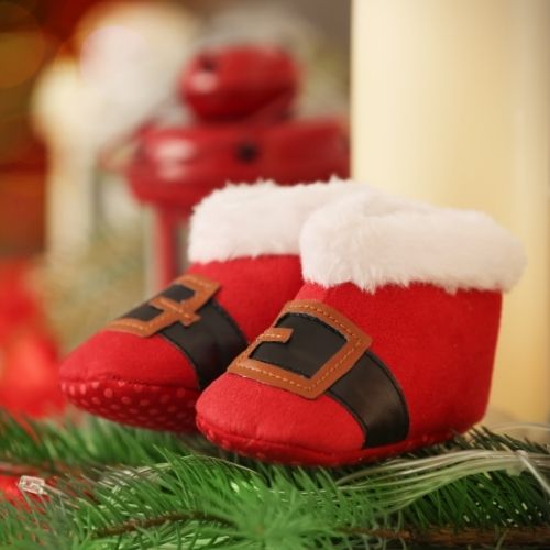 Santa booties for baby on a Christmas tree 