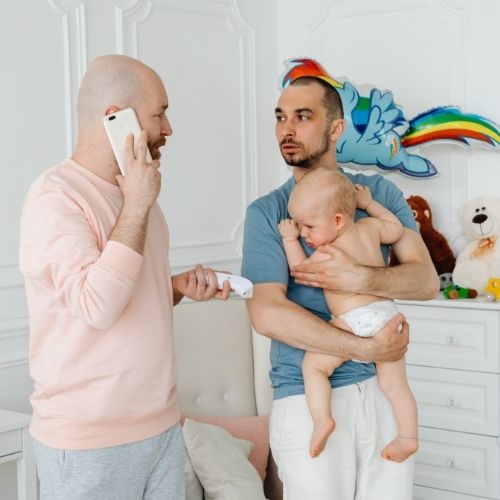 dads calling doctor for sick toddler