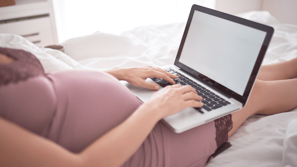 pregnant belly sitting at computer