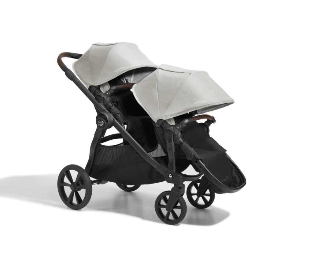 baby jogger city select with two child seats attached 