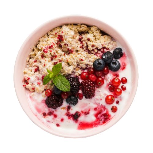 bowl with oatmeal and raspberries and blueberries 